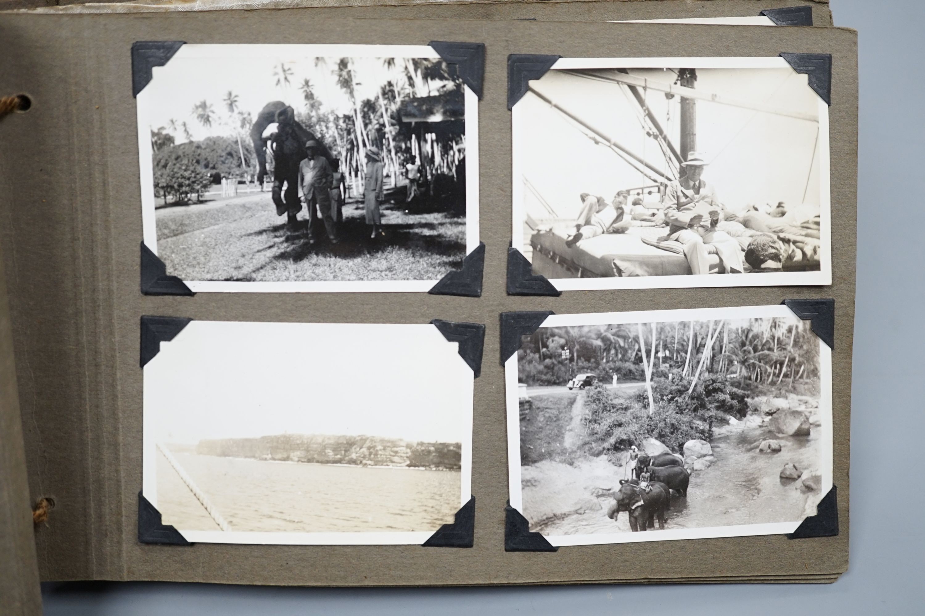 A collection of postcards, a photo album and an album of silks